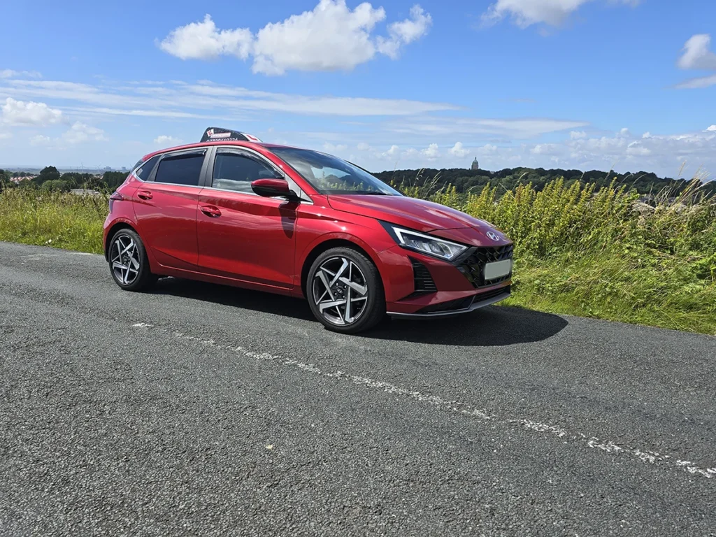 Red tuition car used for manual driving lessons in Lancaster